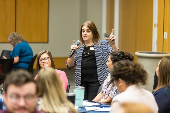 Faculty Developer Dr. Larissa Pires works with new faculty members at New Faculty Orientation.